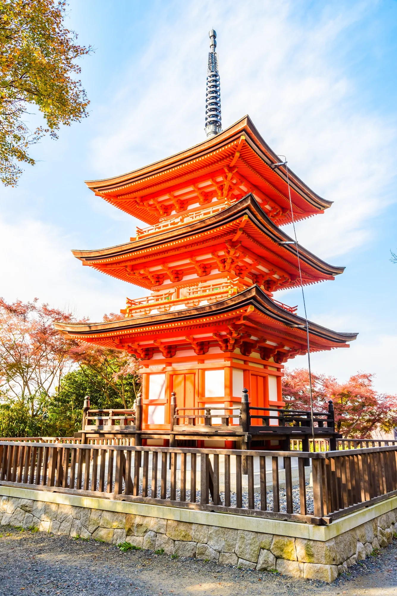 Three stone steps rising between moss-covered lanterns toward a shrine hall